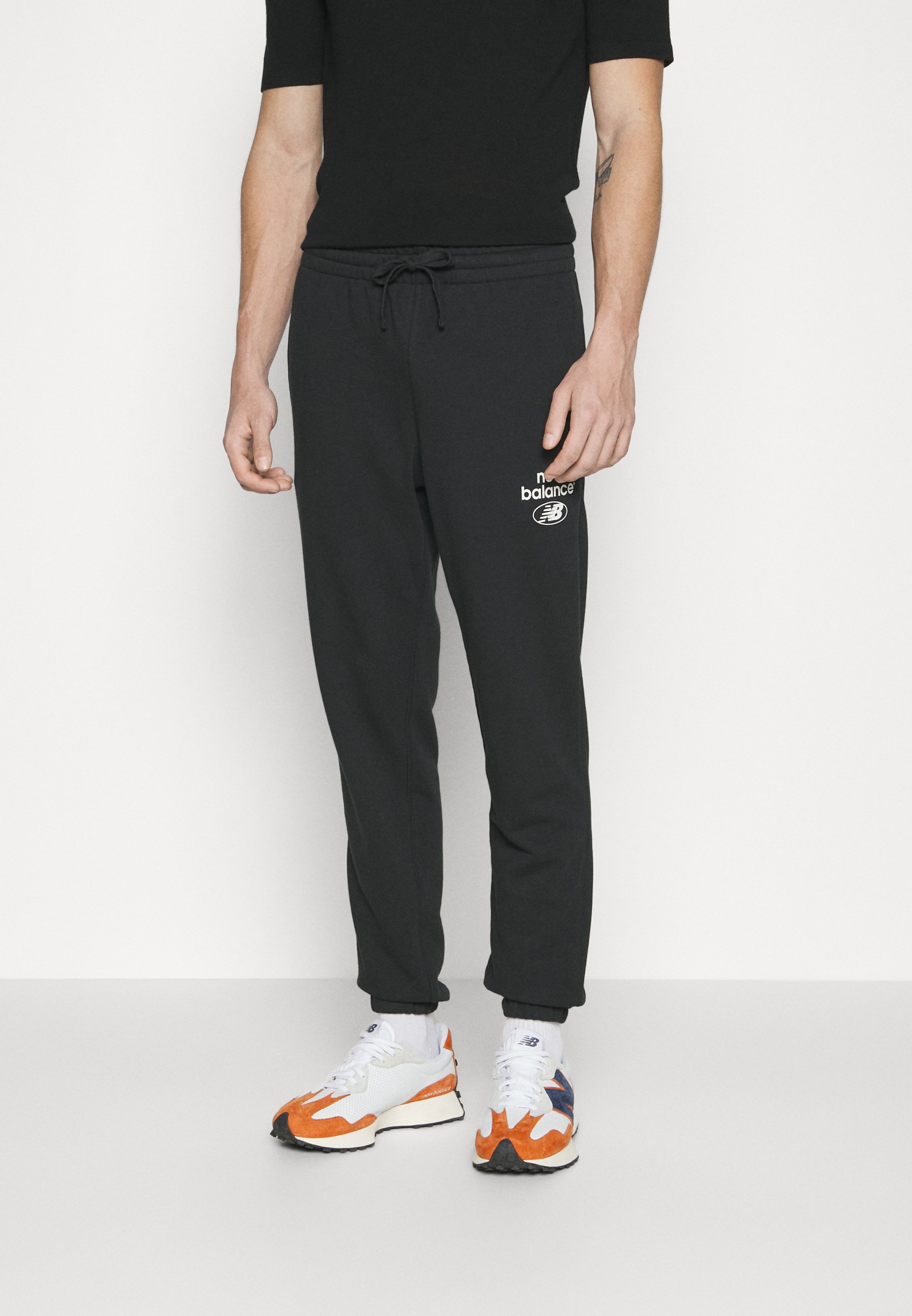 NB ESSENTIALS  - Tracksuit bottoms - black