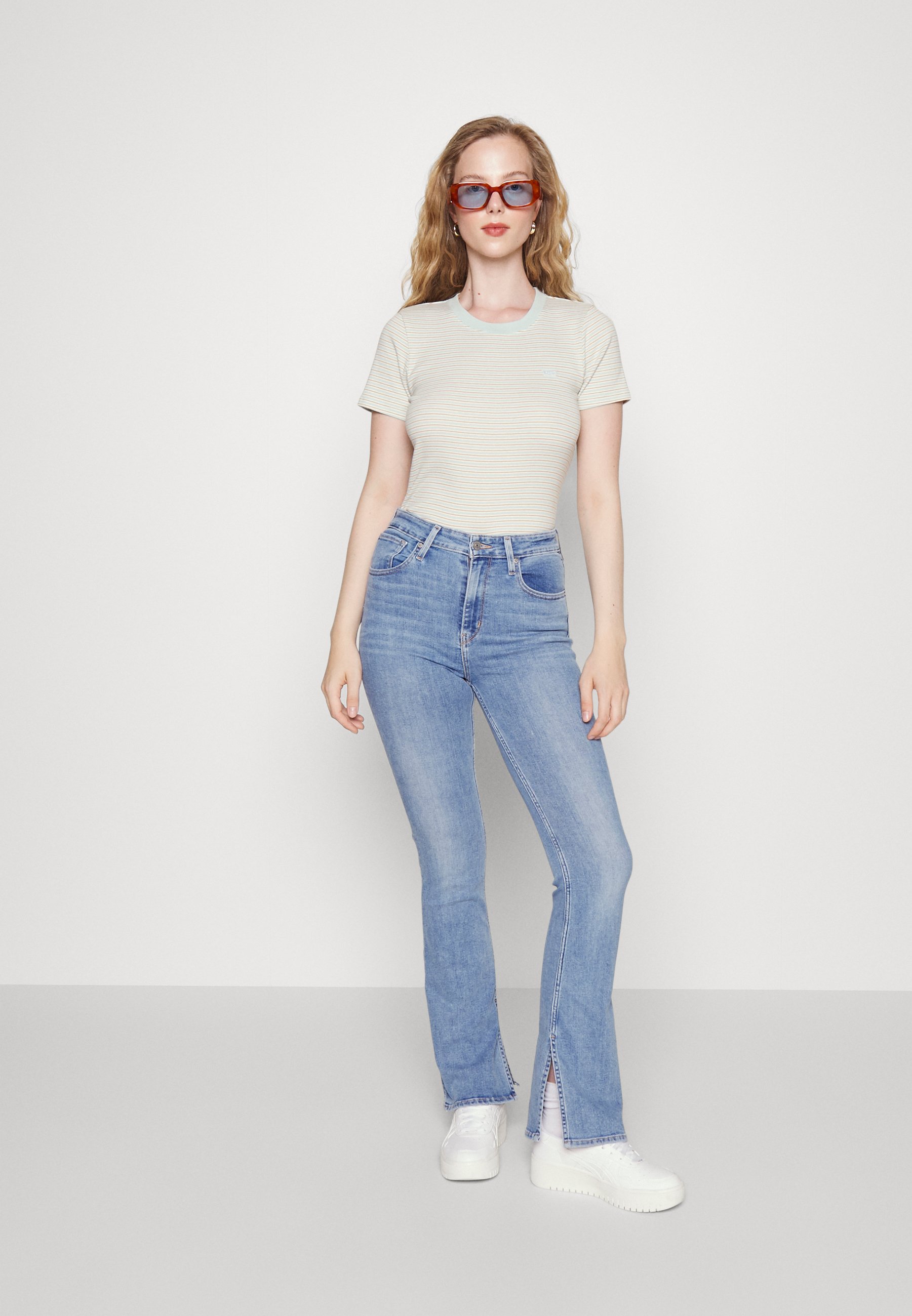 Levi's® 725™ HIGH RISE SLIT BOOTCUT - Flared Jeans - medium indigo/light-blue denim