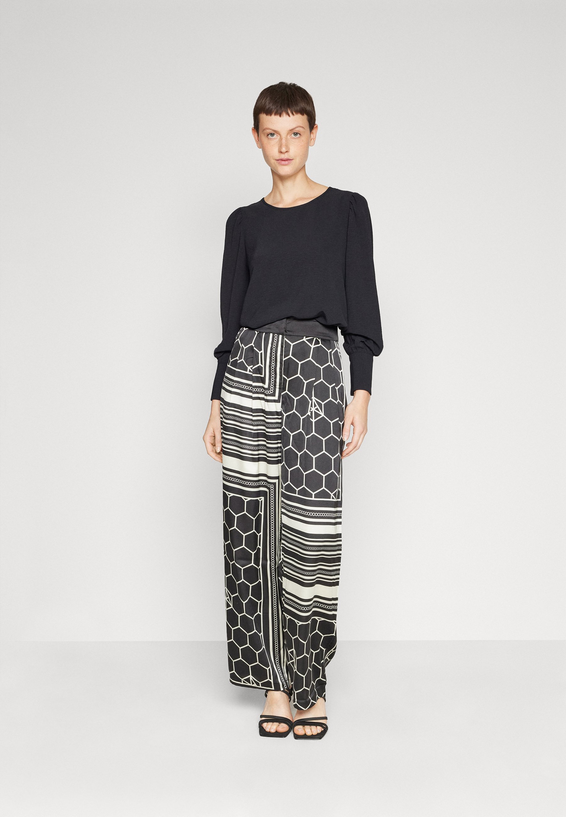 Vero Moda VMMALLE WIDE PANT - Trousers - black/bright white/black