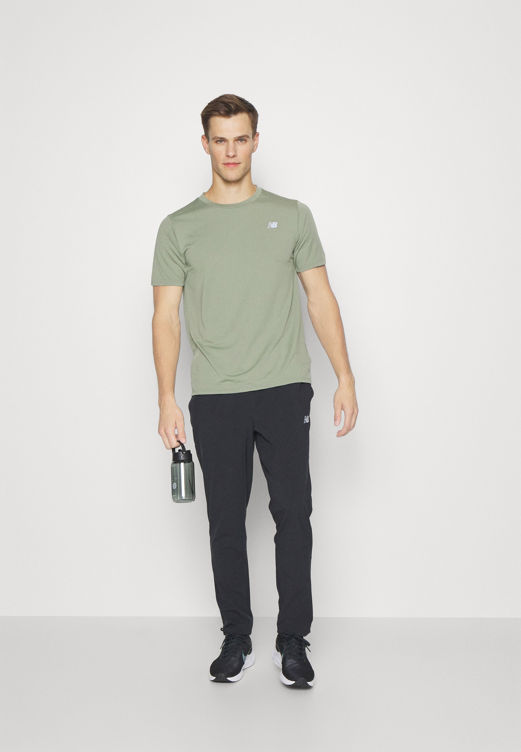 NB ACCELERATE PANT - Tracksuit bottoms - black