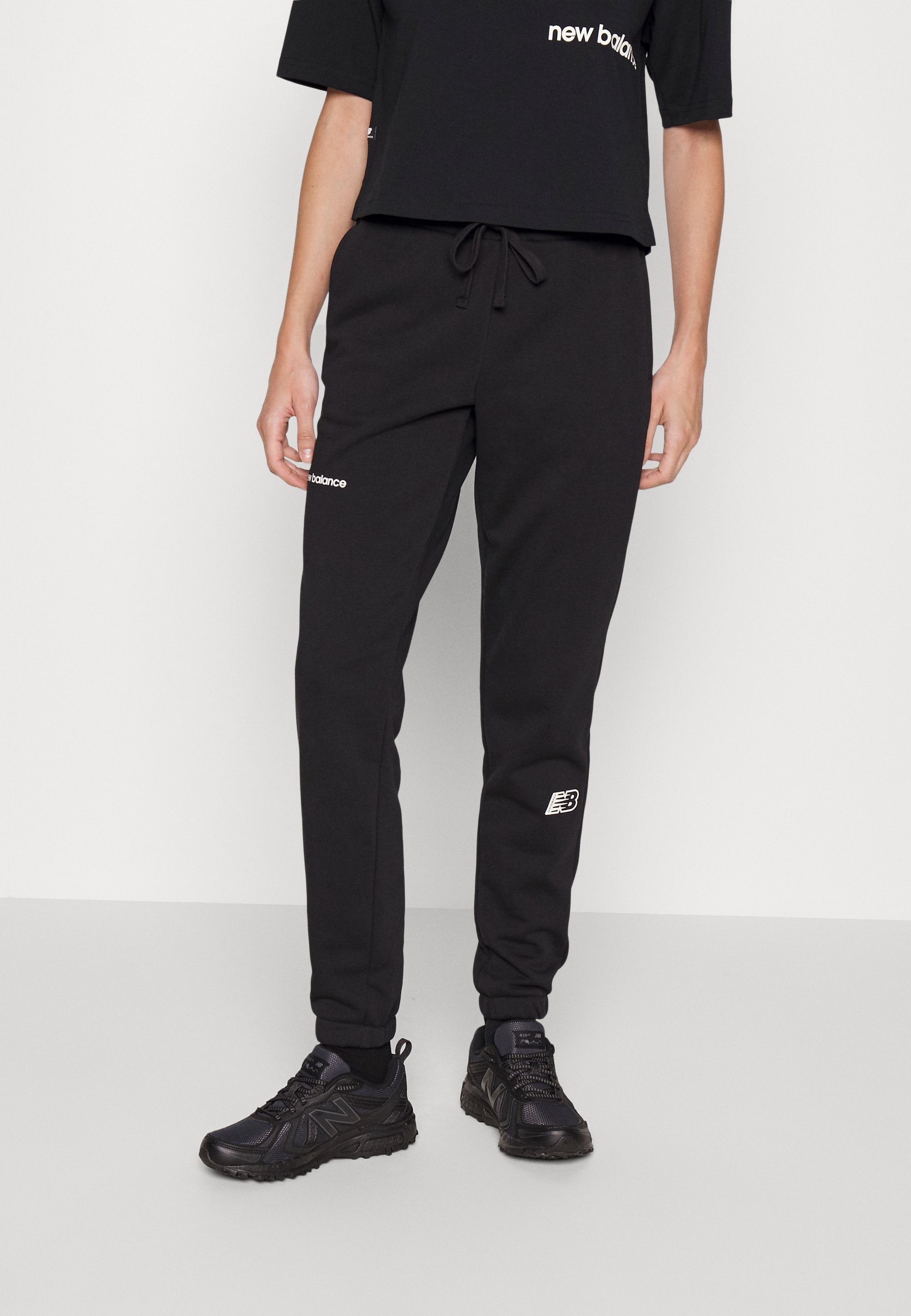 NB ESSENTIALS  - Tracksuit bottoms - black/black