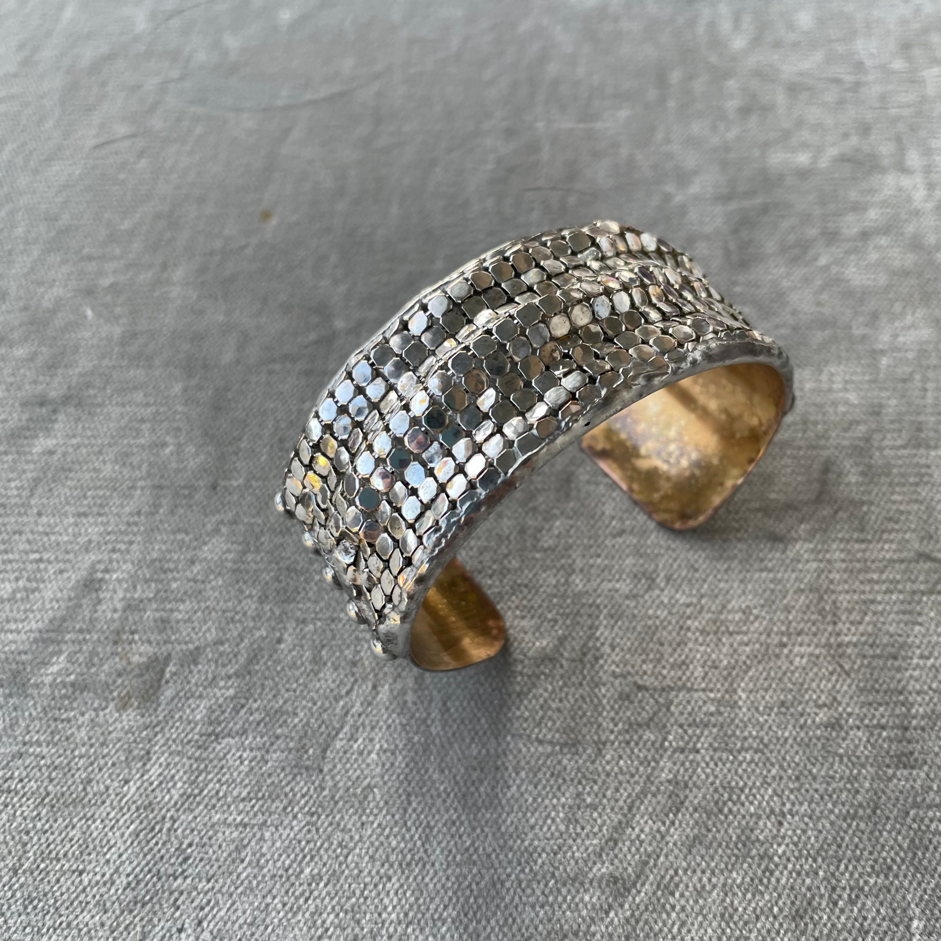 large brass cuff with gold plated brass mesh