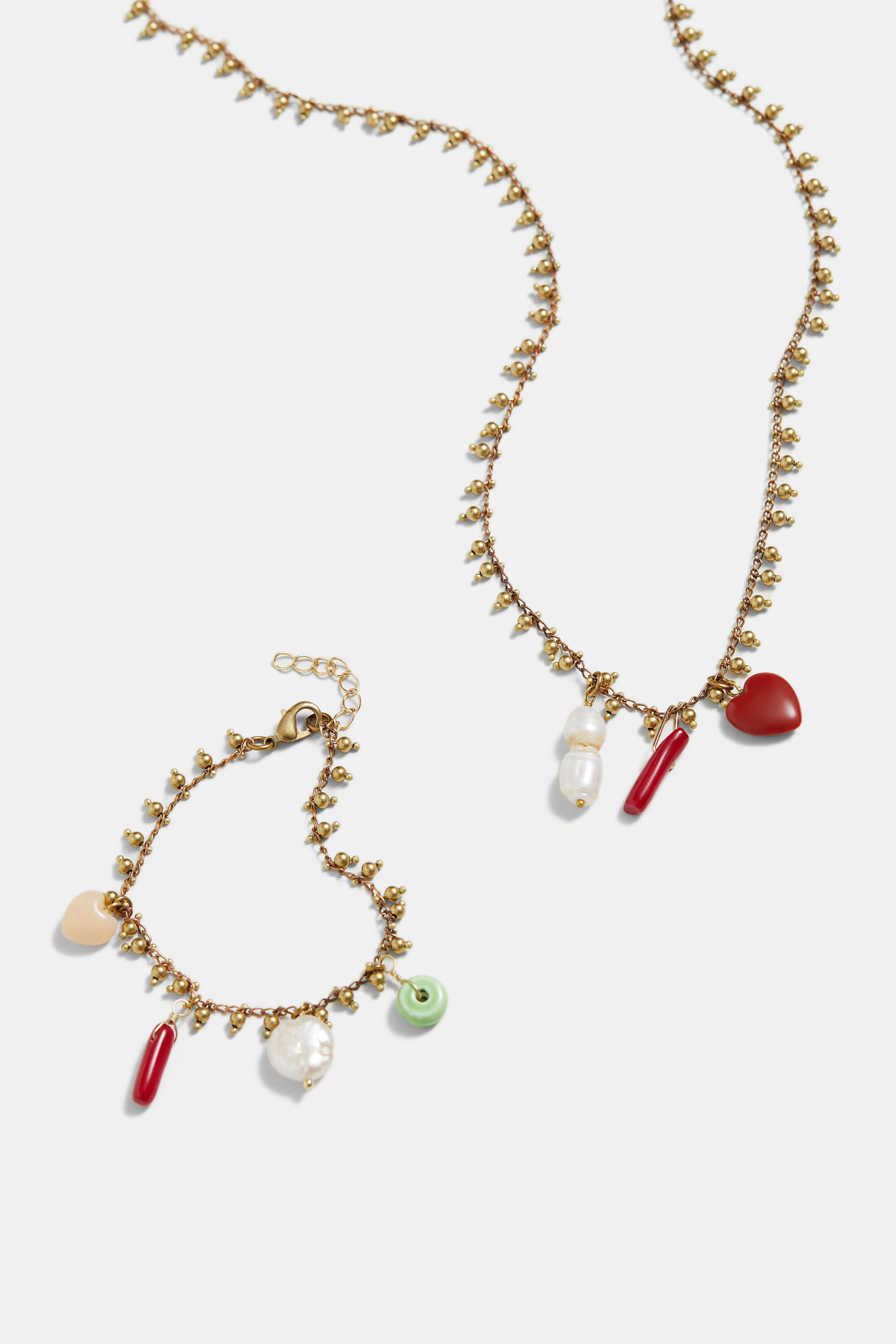 Collar largo dorado charms