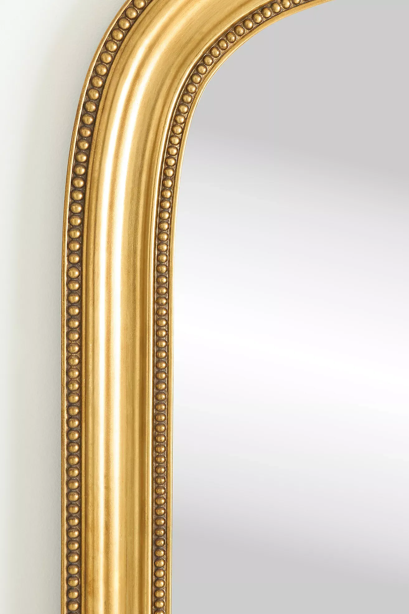 The Gleaming Louie Beaded Arched Floor Mirror