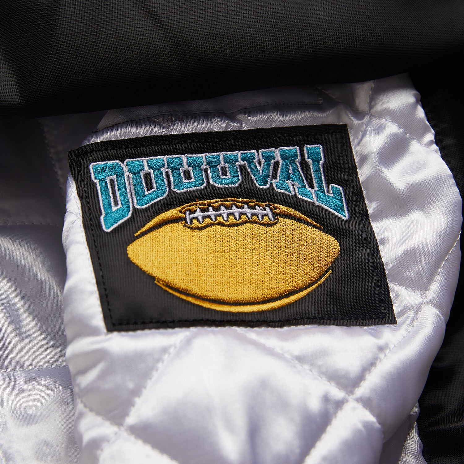 Jacksonville Jaguars HOMAGE X Starter Satin Jacket