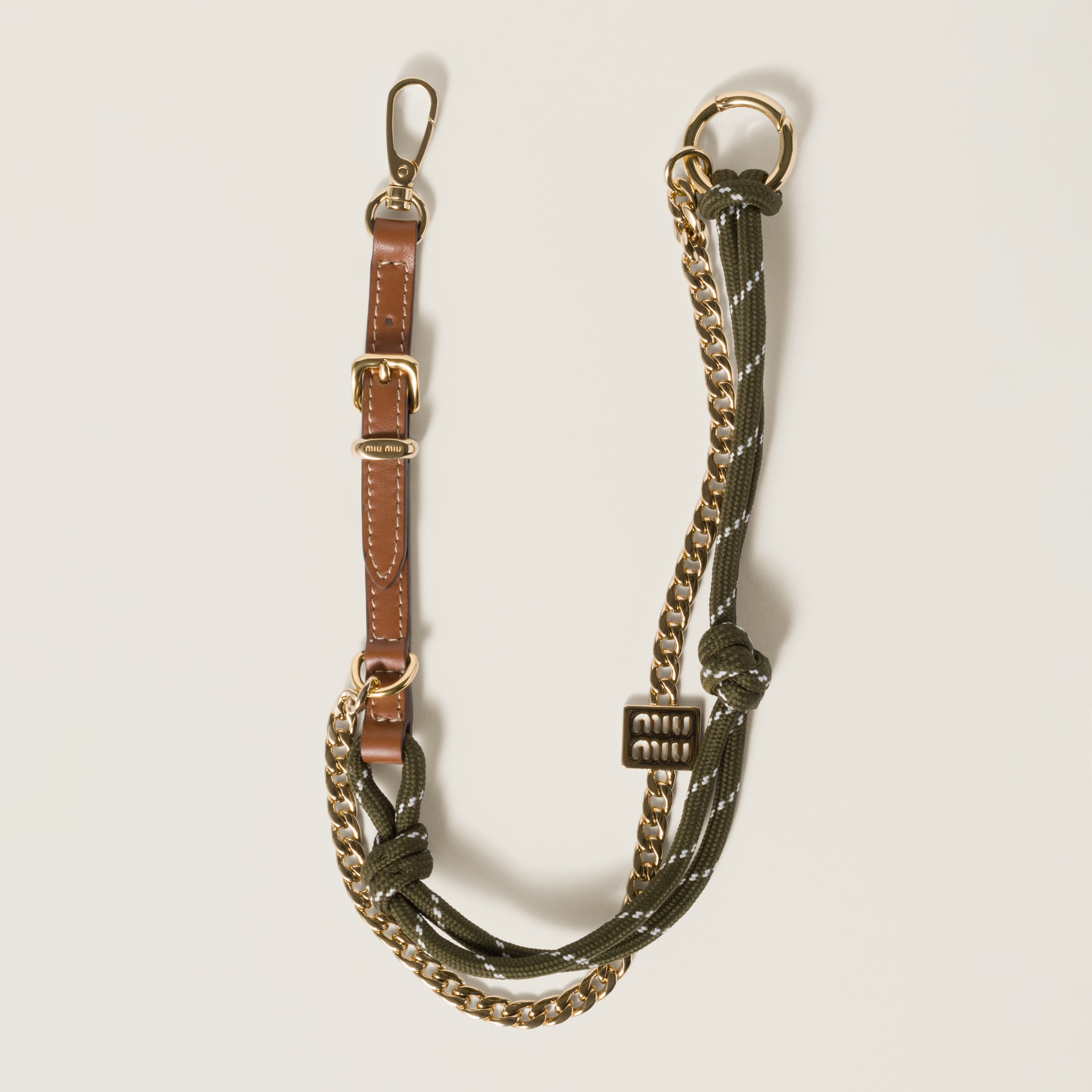 Leather, cord and metal trick