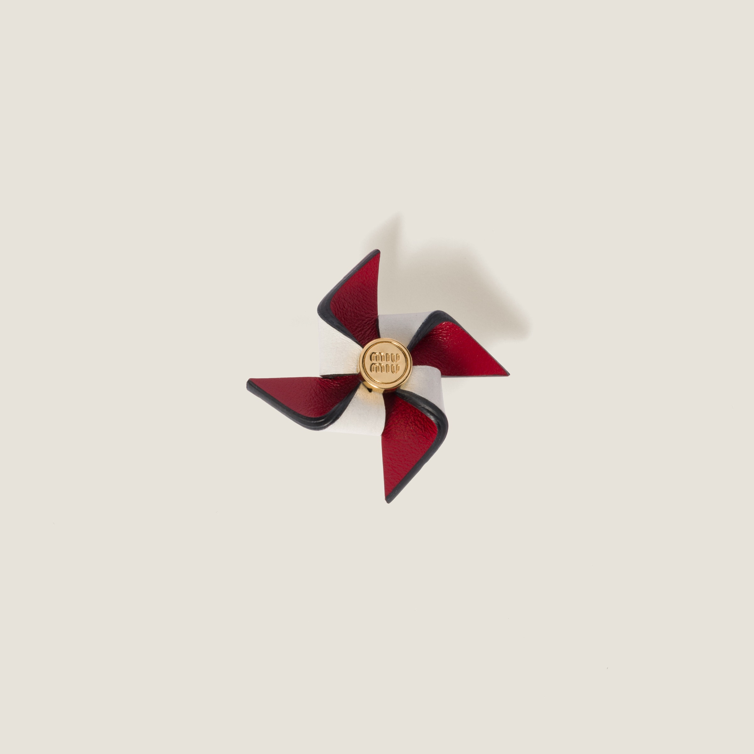 Leather pinwheel brooch