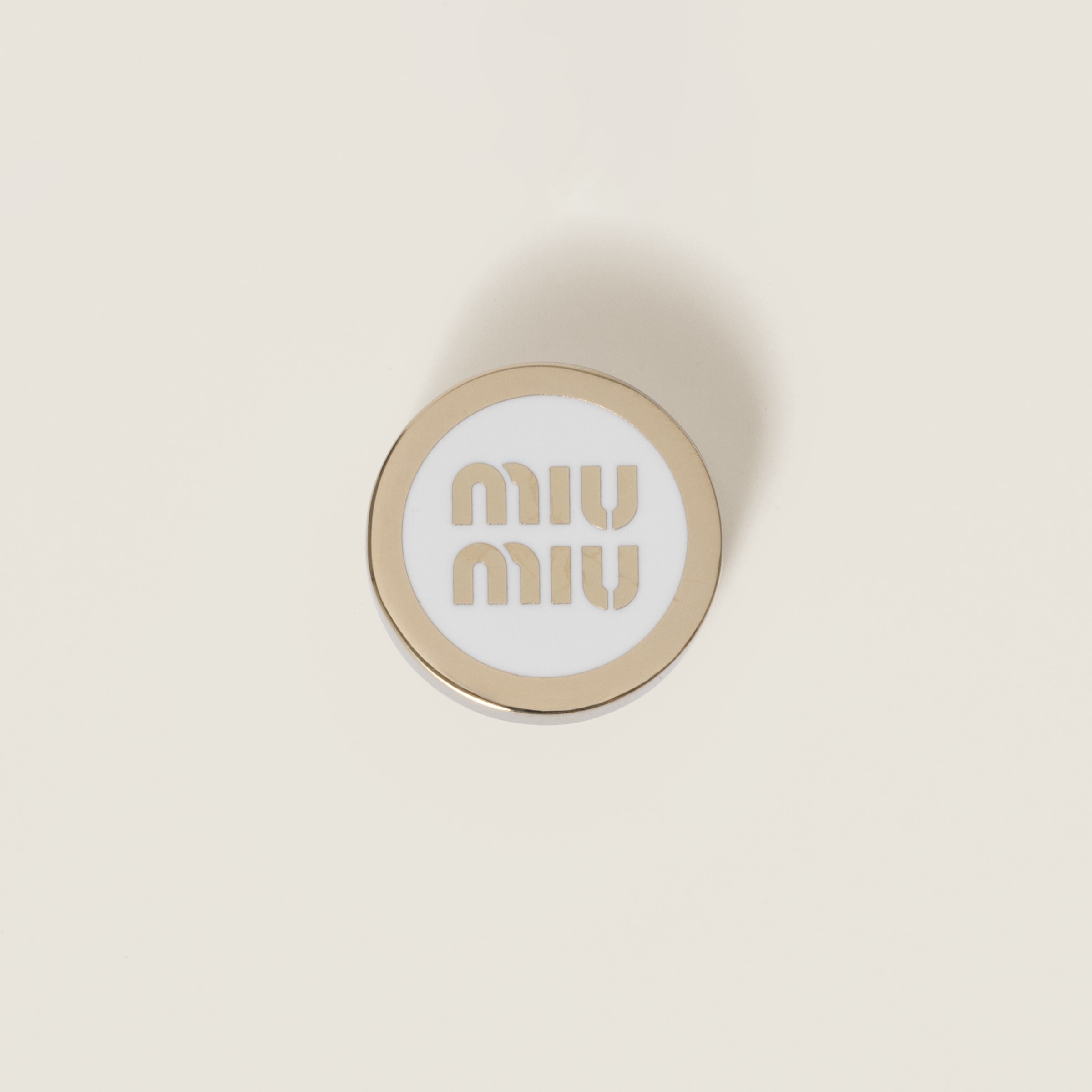 Enameled metal logo brooch