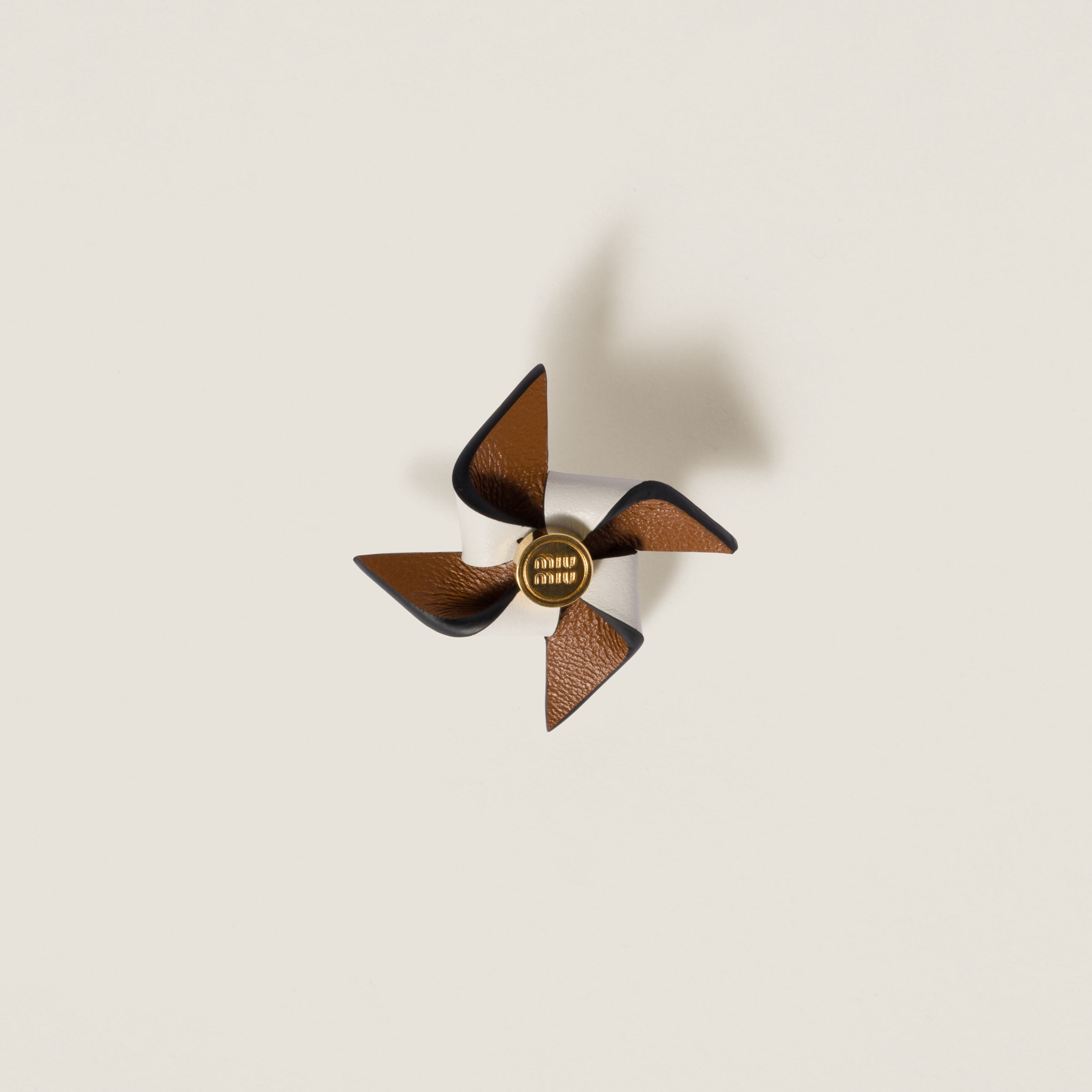 Leather pinwheel brooch