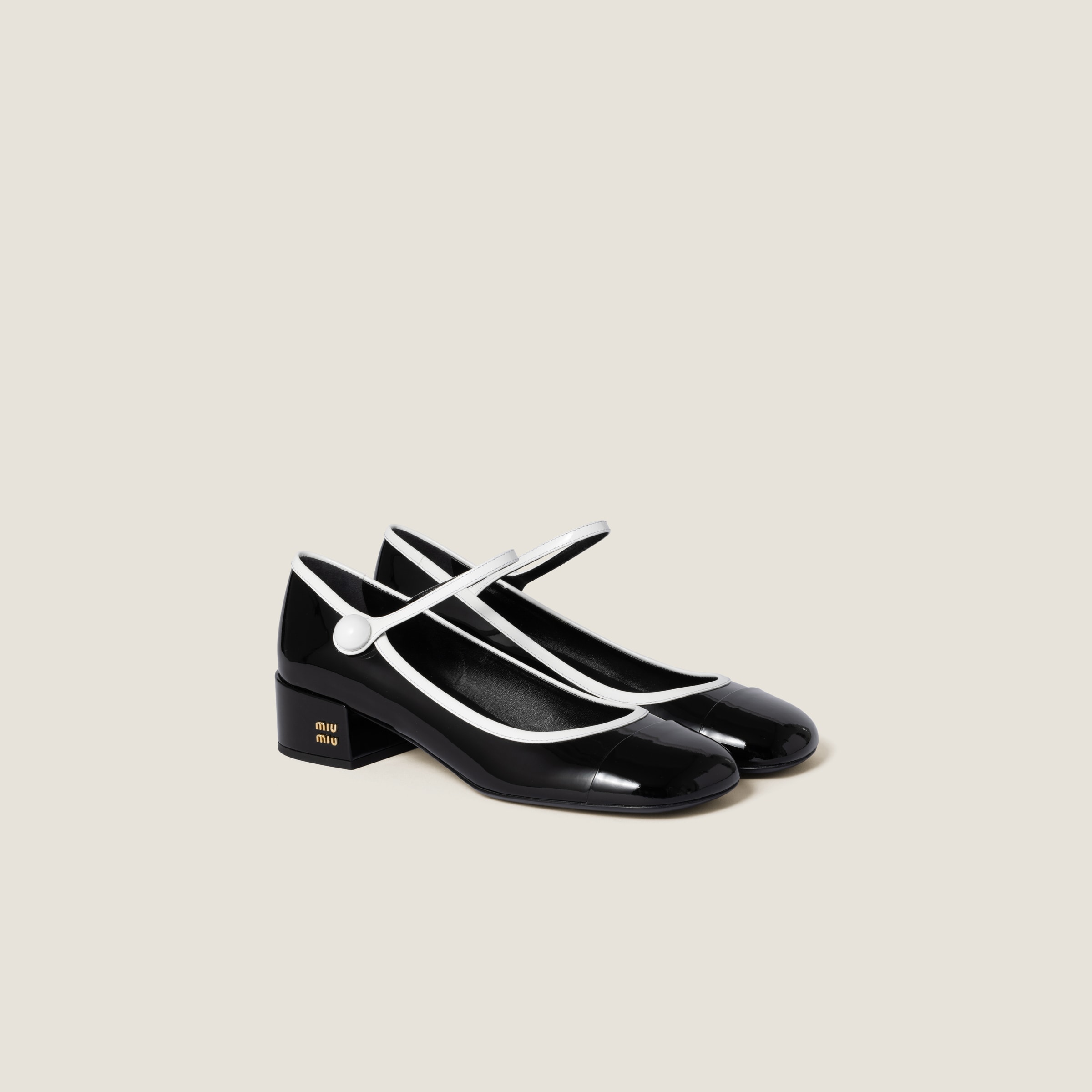 Two-tone patent leather Mary Jane pumps