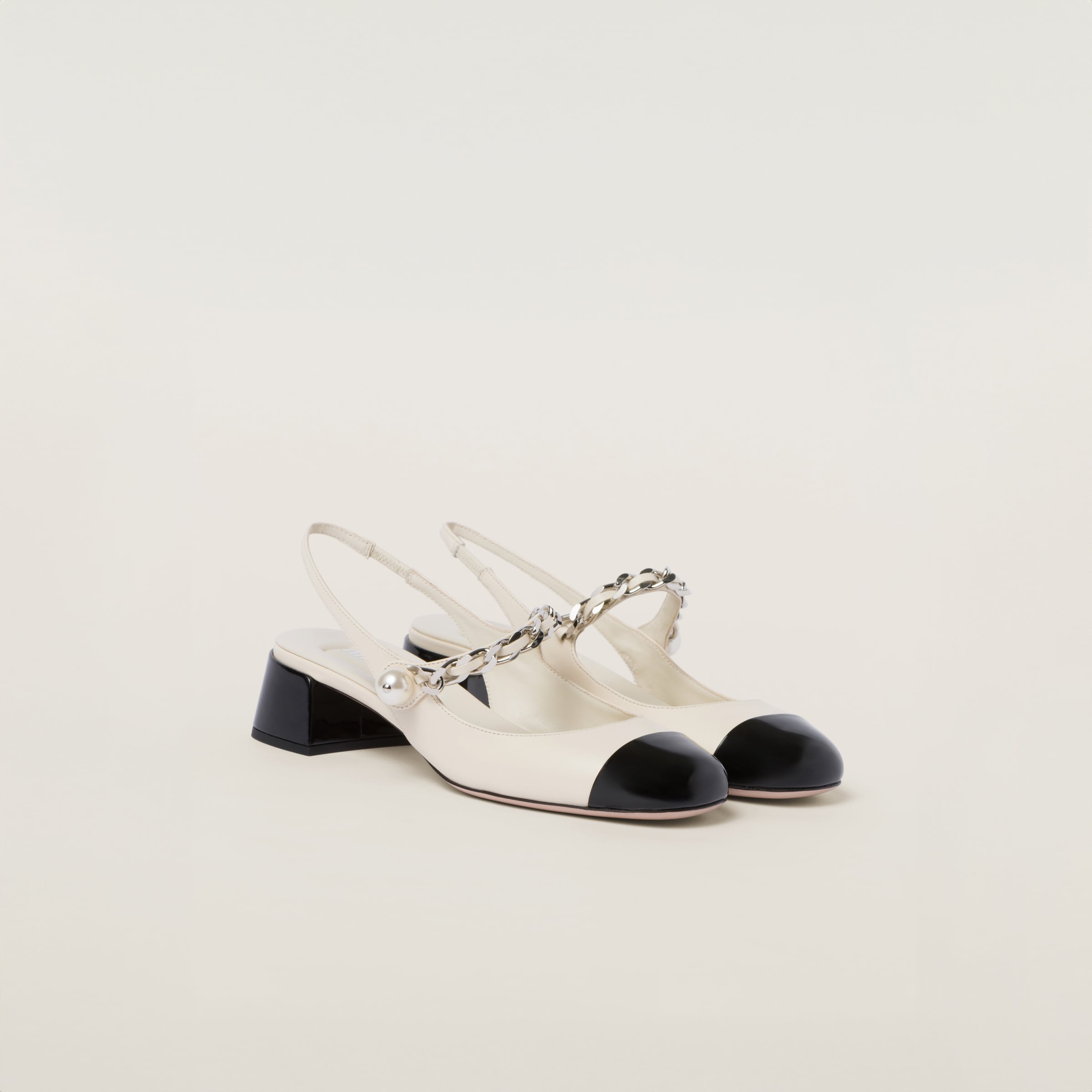 Leather and patent leather slingback pumps