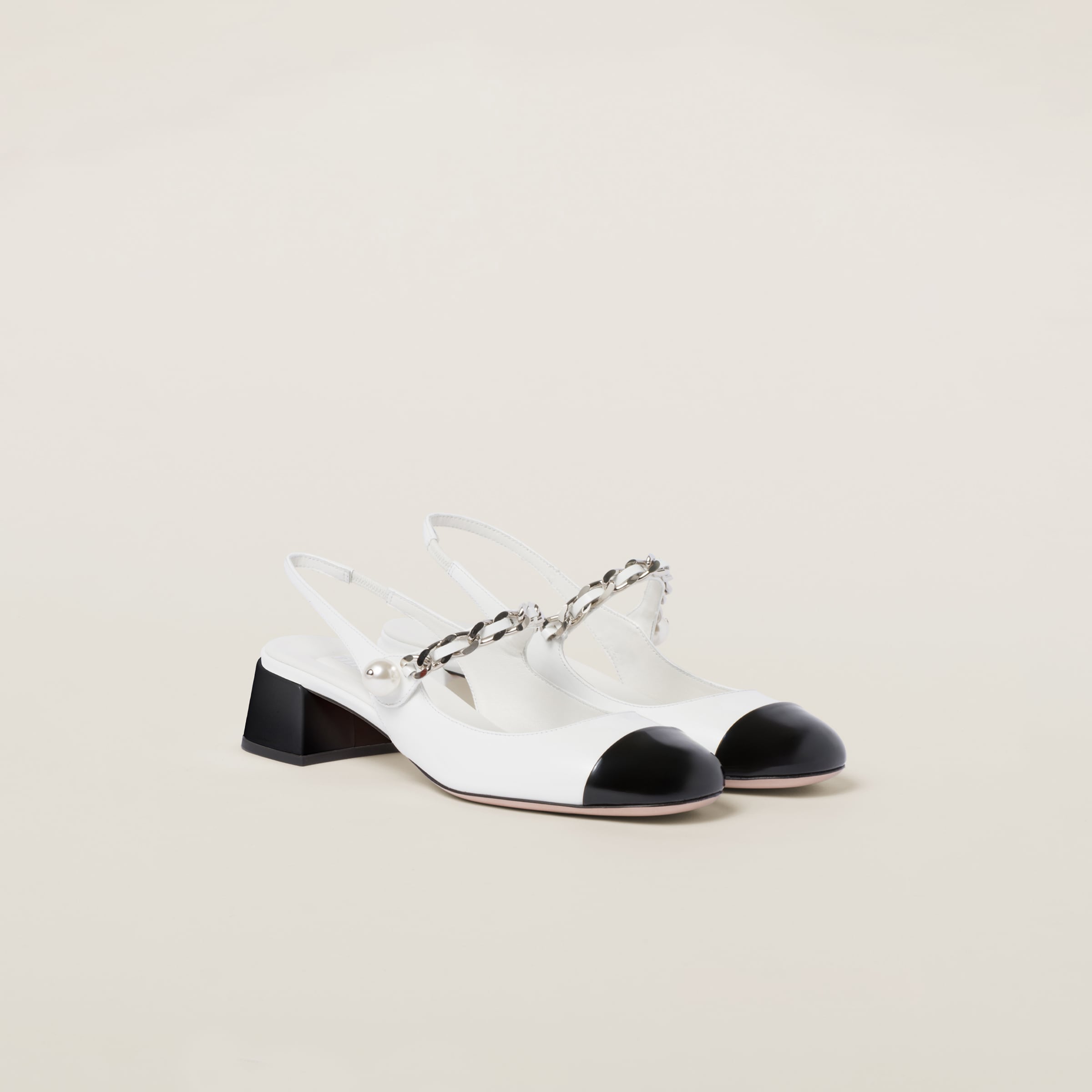 Two-tone patent leather slingback pumps