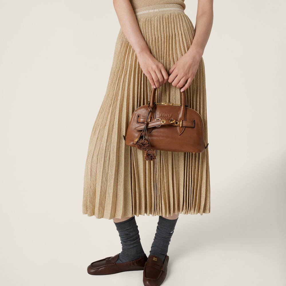 Pleated lamé skirt