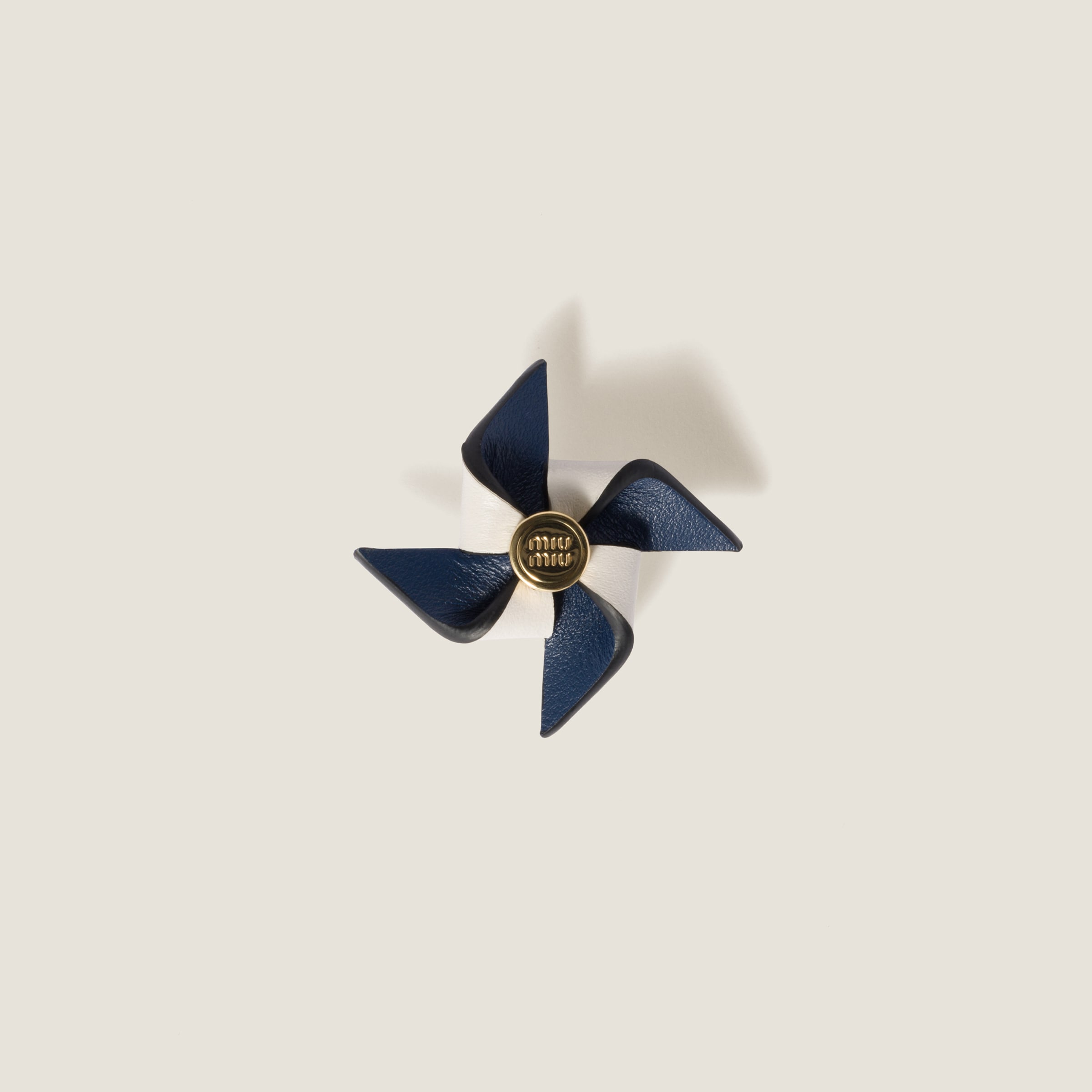Leather pinwheel brooch