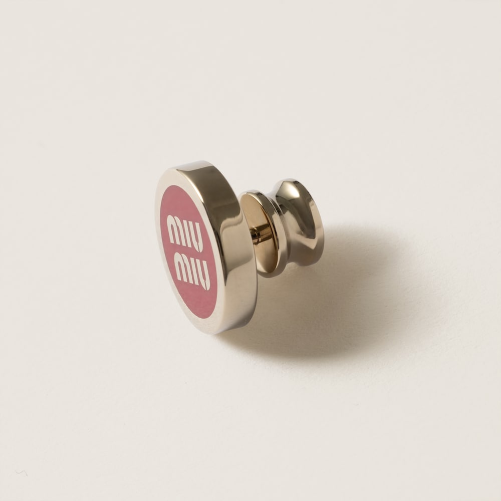 Enameled metal logo brooch