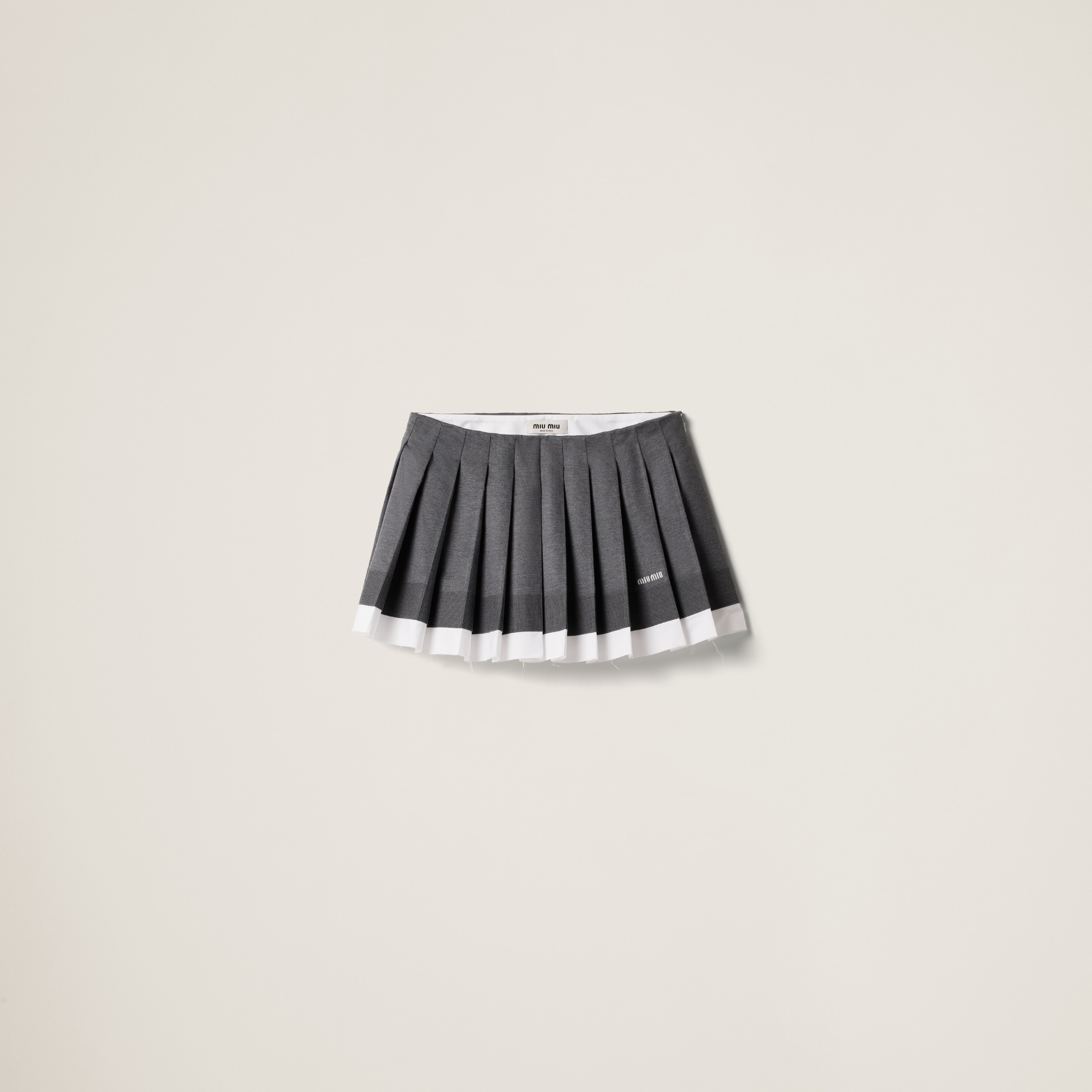 Knit and poplin pleated miniskirt