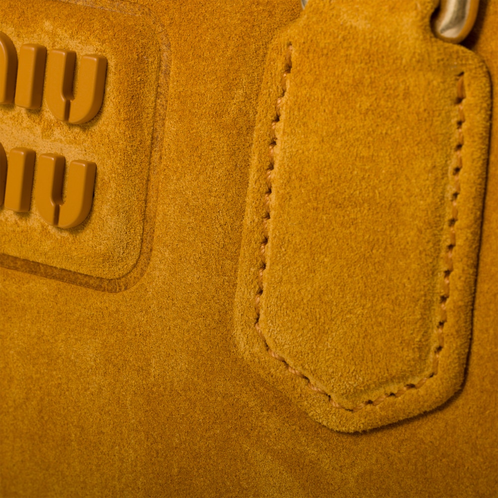 Arcadie padded suede top-handle bag
