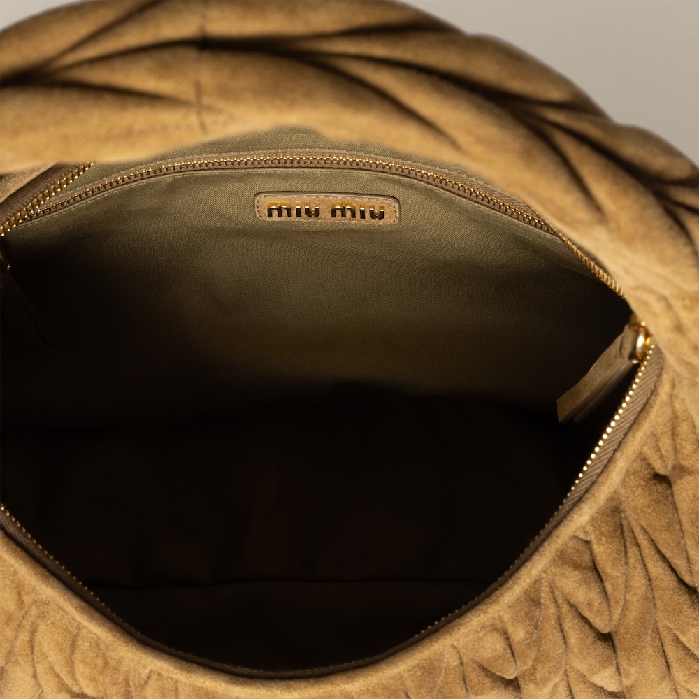 Wander matelassé suede bag