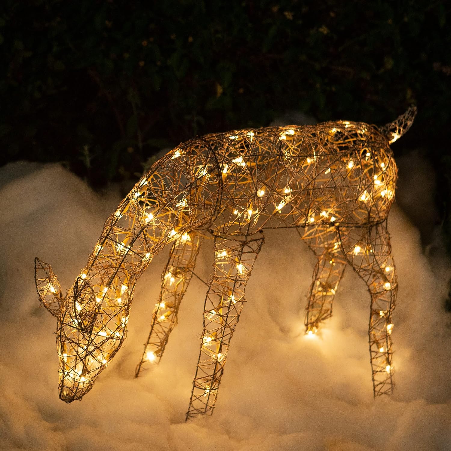 Alpine Corporation 24 Tall Outdoor Rattan Grazing Reindeer Lawn Decoration with White LED Lights, Christmas Yard Decor, Holiday Garden Display