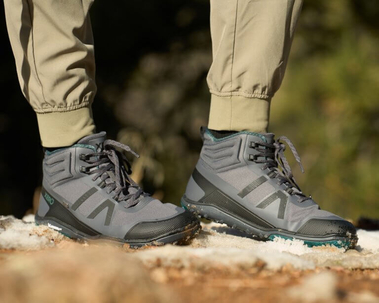 A woman wearing Scrambler Mid II WP boots in the snow and slush