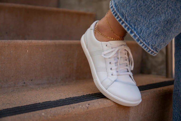 A woman walking down the stairs in her Dillon Leather shoes