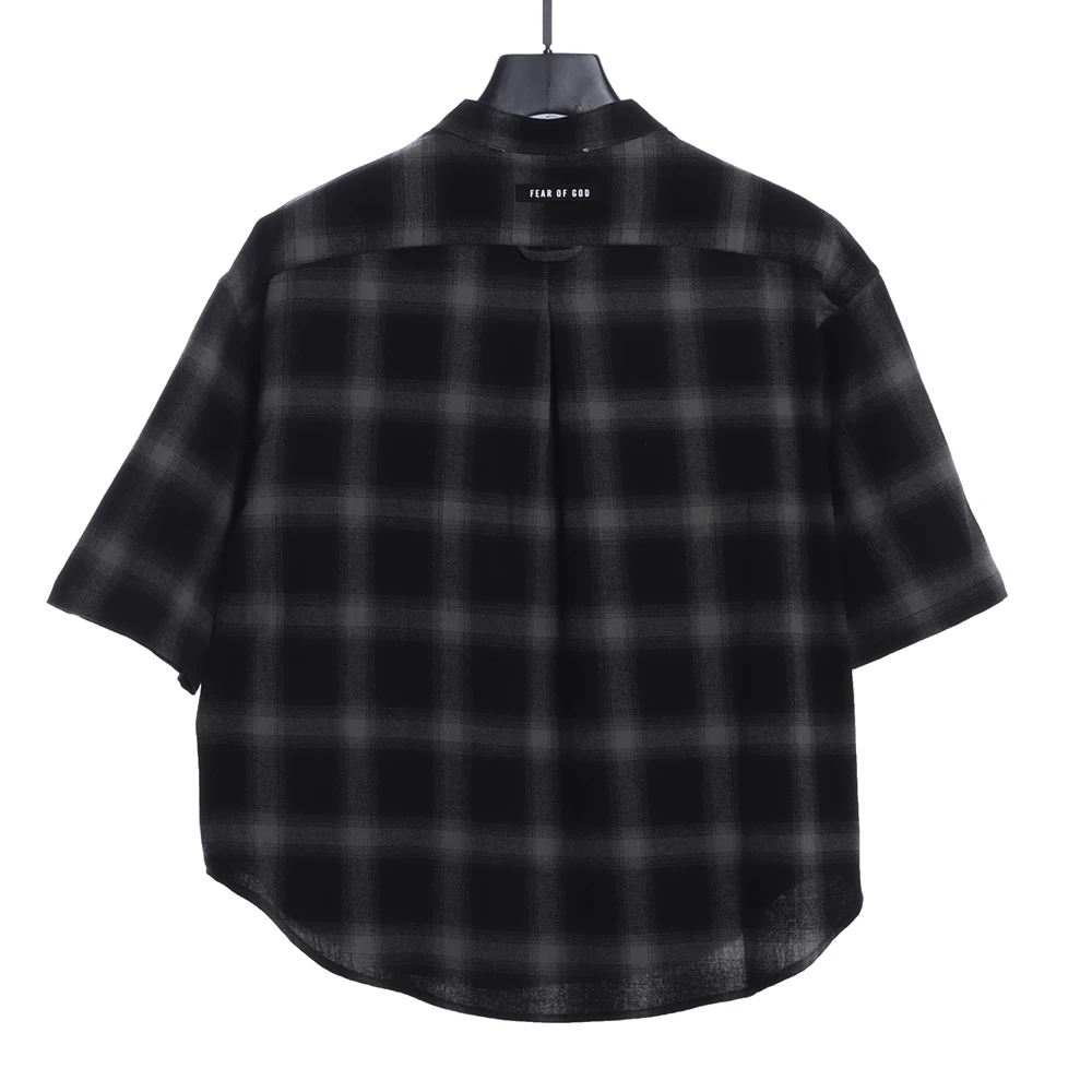 Half buttoned plaid shirt