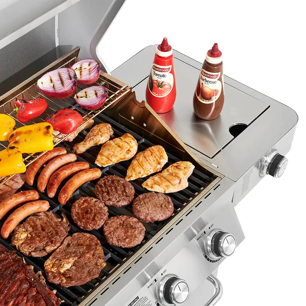 Monument Grills 4-Burner Propane Gas Grill in Stainless with Clear View Lid, LED Controls and Side Burner