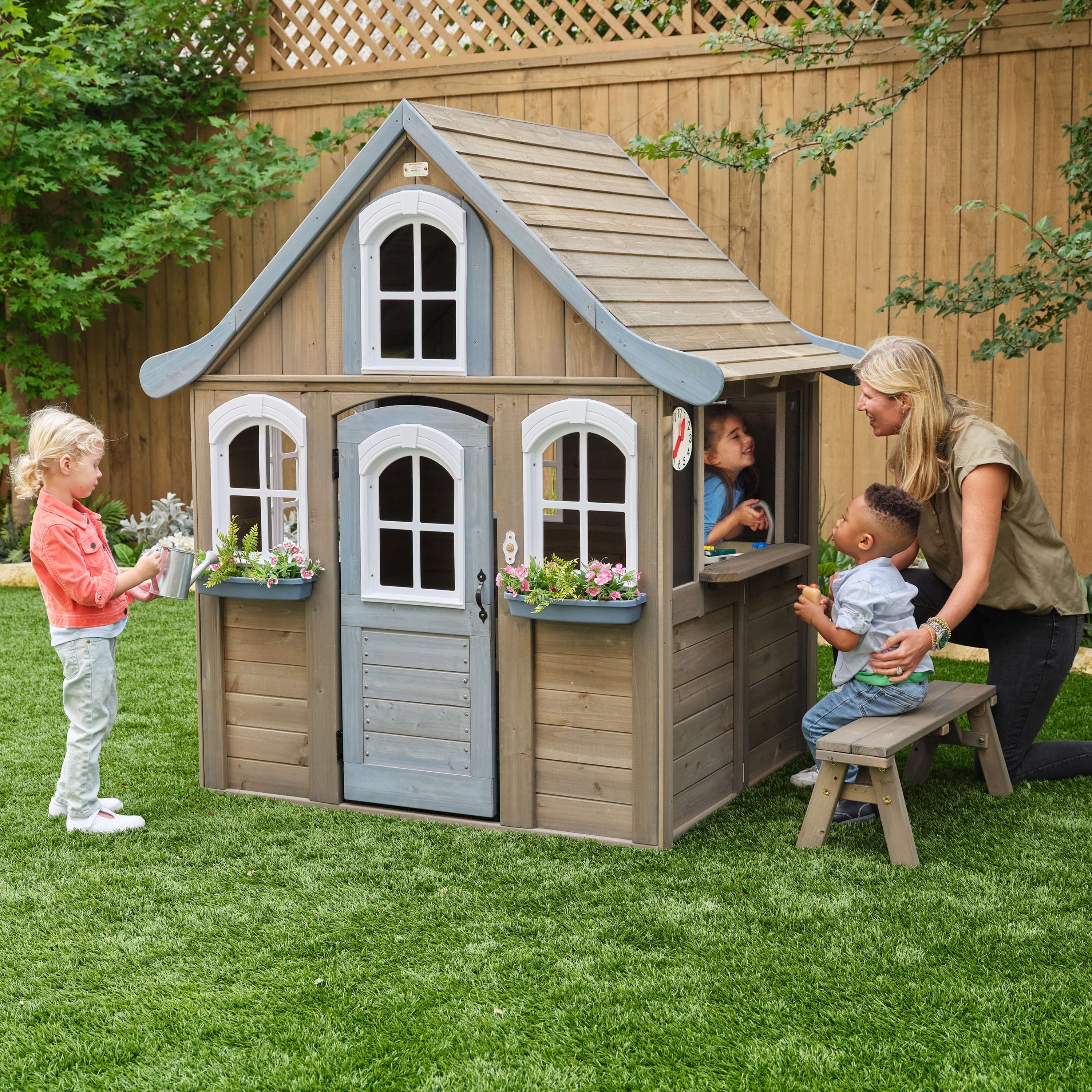 KidKraft Forestview II Wooden Outdoor Playhouse with Ringing Doorbell, Bench and Kitchen