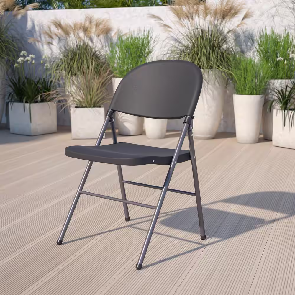 Flash Furniture Hercules Series 330 lb. Capacity Black Plastic Folding Chair with Charcoal Frame