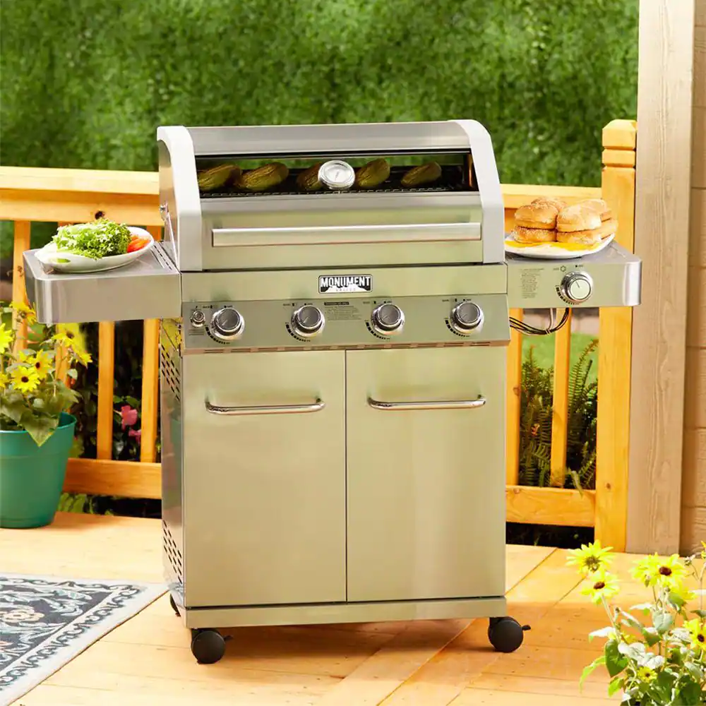 Monument Grills 4-Burner Propane Gas Grill in Stainless with Clear View Lid, LED Controls and Side Burner