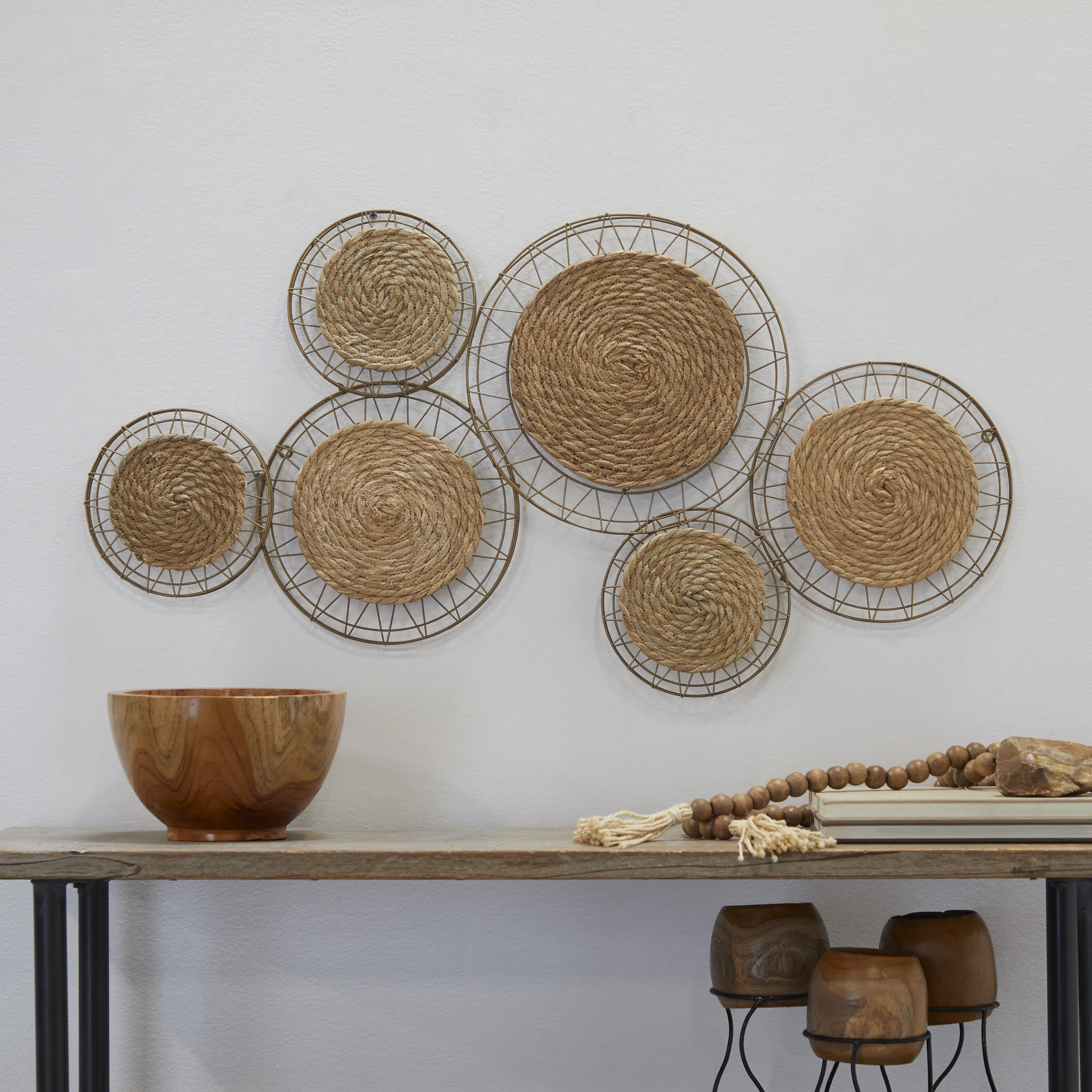 The Novogratz Brown Dried Plant Handmade Woven Plate Wall Decor with Intricate Patterns
