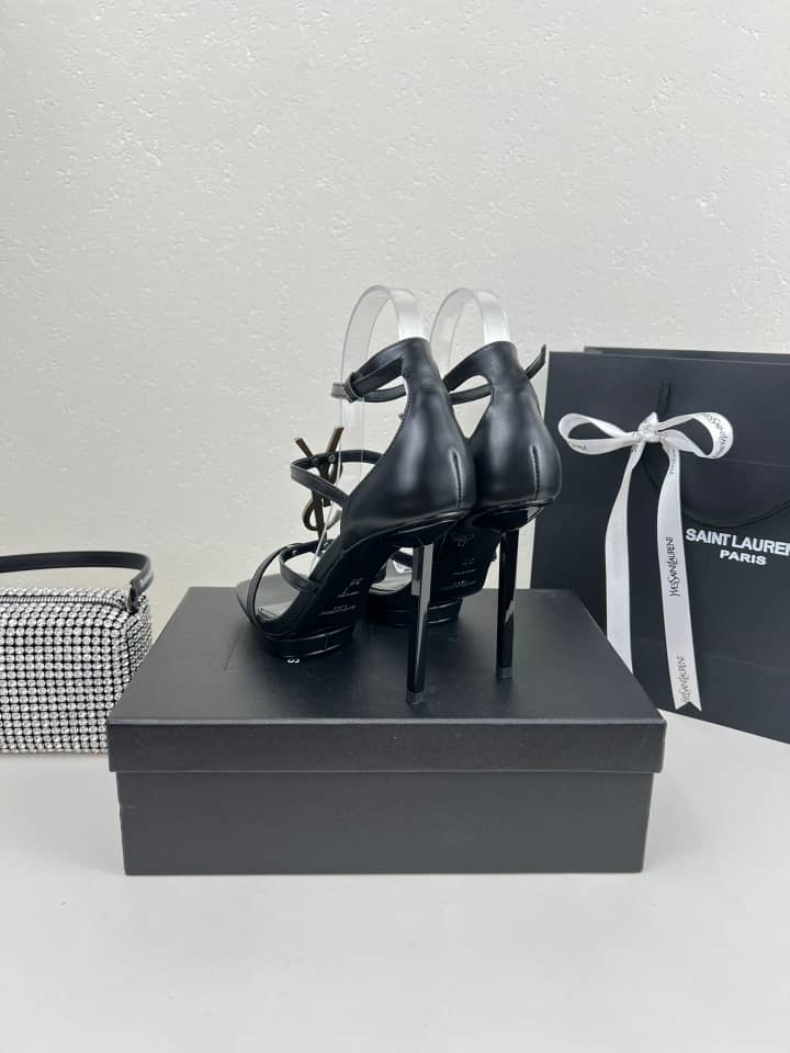 SAINT LAURENT CASSANDRA SANDALS IN PATENT LEATHER NOIR - vstockx