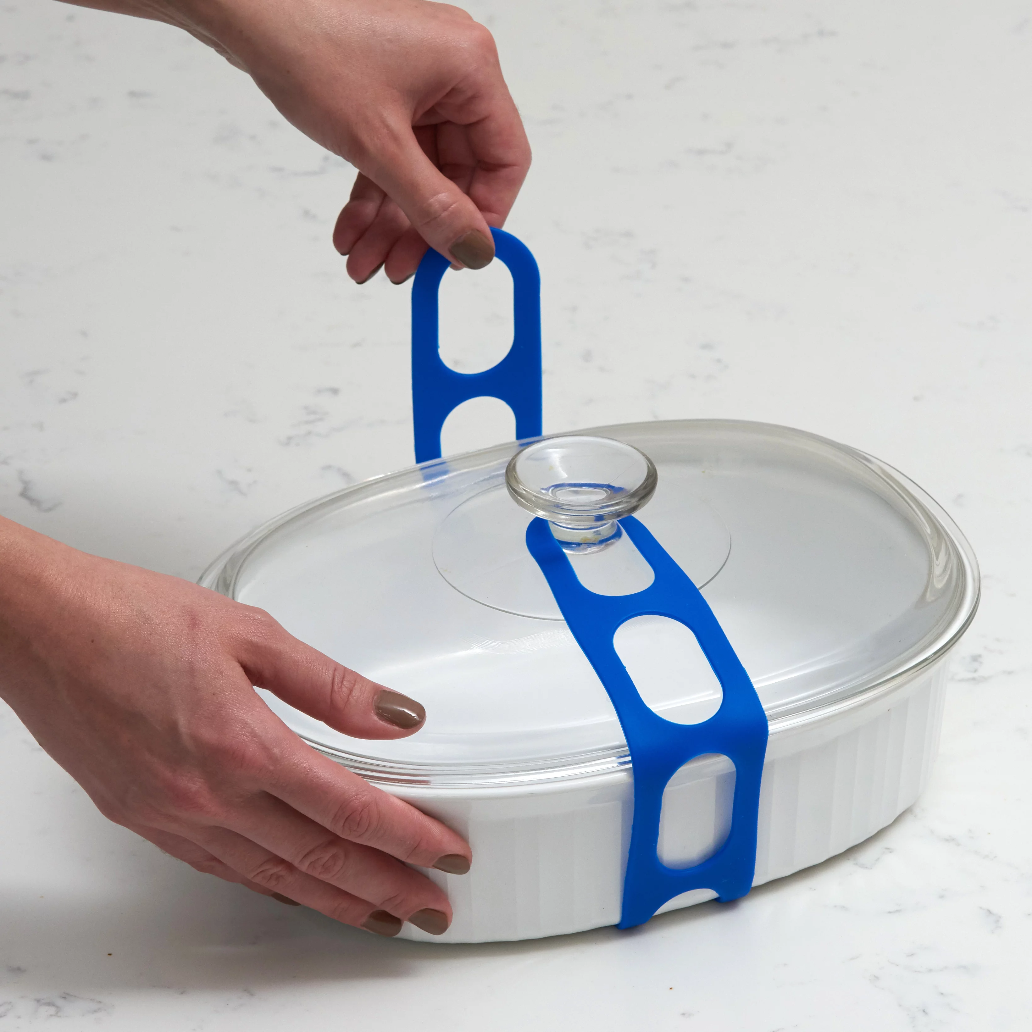Lid Latch the reusable universal lid securing strap for crockpots, casserole dishes, pots, pans and more. Make it easy to transport your favorite dishes with one simple strap. (Blue/Grey)