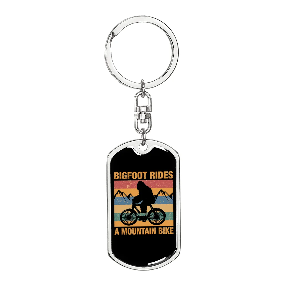 Big Foot Rides A Mountain Bike Cycling Stainless Steel or 18k Gold Premium Swivel Dog Tag Keychain
