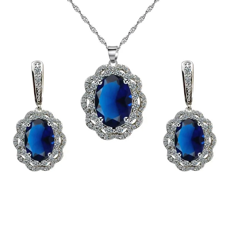 Bonjour Jewelers 18K White Gold Created Oval Blue Sapphire Halo And White Sapphire Earrings & Necklace Set Plated