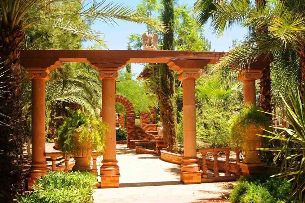 12-Feet Wide by 8-Feet high. Prepasted Robust Wallpaper Mural from a Photo of: Tropical Garden with Columns and an Arbor. Our murals are Easy to Install Remove and Reuse (Hang Again) See Our Video.