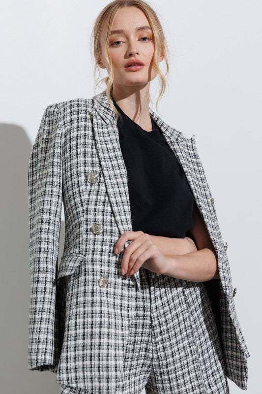 Plaid blazer outfit with snakeskin boots