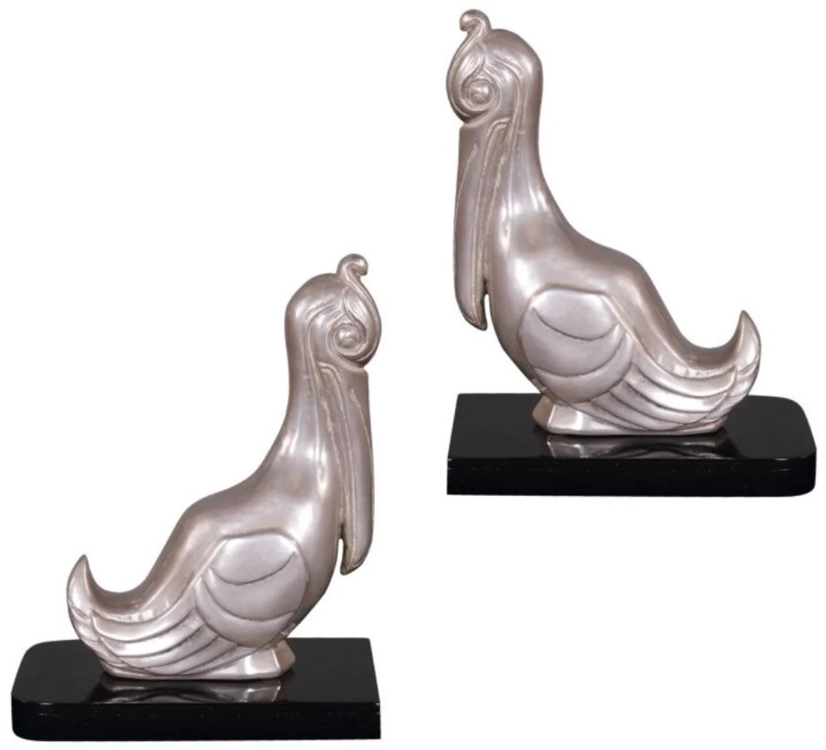 Casa Padrino conjunto de sujetalibros de lujo pelícanos plata / negro 18 x 12 x H. 22 cm - Figuras de Bronce Plateado Decorado con Base de Madera