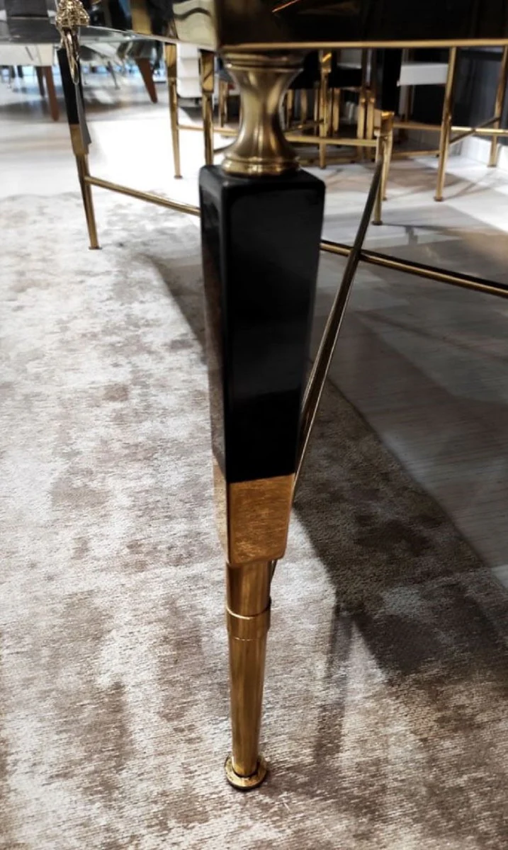 Casa Padrino mesa de centro de lujo negro / oro 130 x 70 x A. 45 cm - Mesa de sal¨®n con tablero de m¨¢rmol artificial - Muebles de sal¨®n de lujo - Muebles de hotel - Interior de lujo