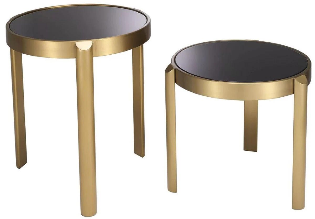 Casa Padrino conjunto de mesa auxiliar de lujo lat¨®n / negro - 2 Mesas redondas de acero inoxidable con tapa de vidrio - Muebles de sal¨®n - Muebles de hotel - Muebles de lujo - Interiores de lujo