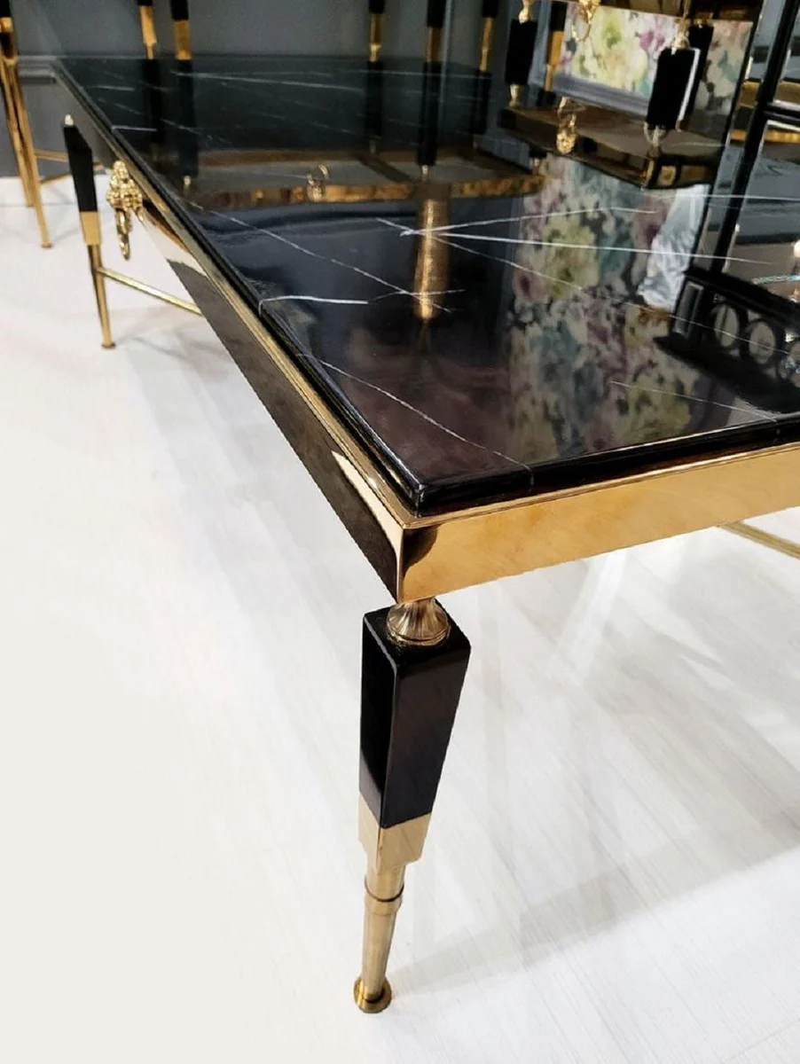 Casa Padrino mesa de centro de lujo negro / oro 130 x 70 x A. 45 cm - Mesa de sal¨®n con tablero de m¨¢rmol artificial - Muebles de sal¨®n de lujo - Muebles de hotel - Interior de lujo