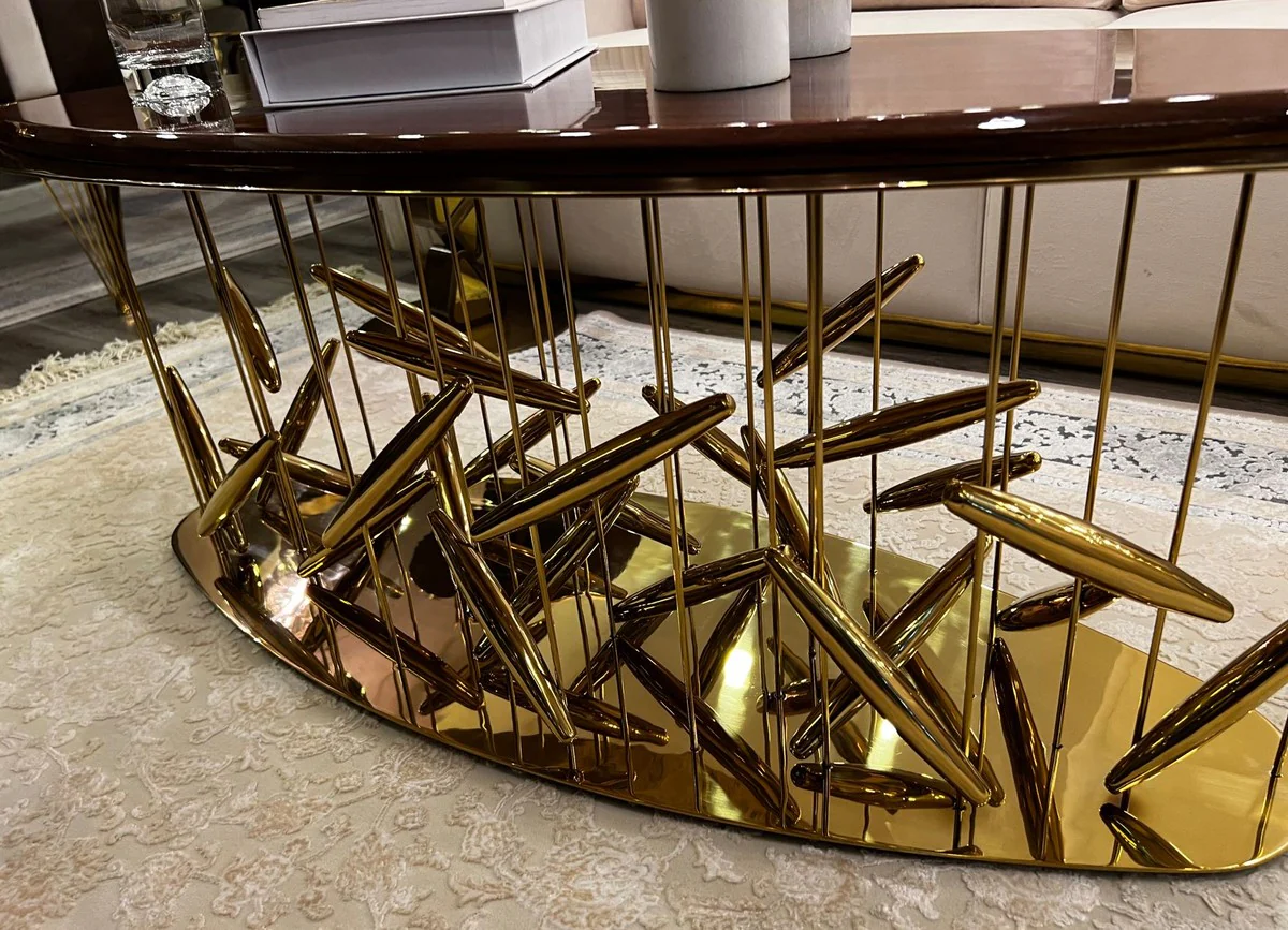 Casa Padrino mesa de centro de lujo marr¨®n / oro 120 x 51 x A. 47 cm - Mesa de sal¨®n ovalada de acero inoxidable con tablero de madera maciza - Muebles de sal¨®n - Muebles de lujo