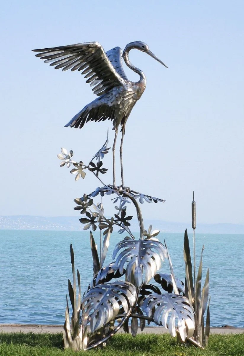 Casa Padrino escultura de jardín de lujo de acero inoxidable garza en rama plata 103 x 108 x A. 218 cm - Figura de decoración de jardín hecha a mano - Decoración de jardín de lujo