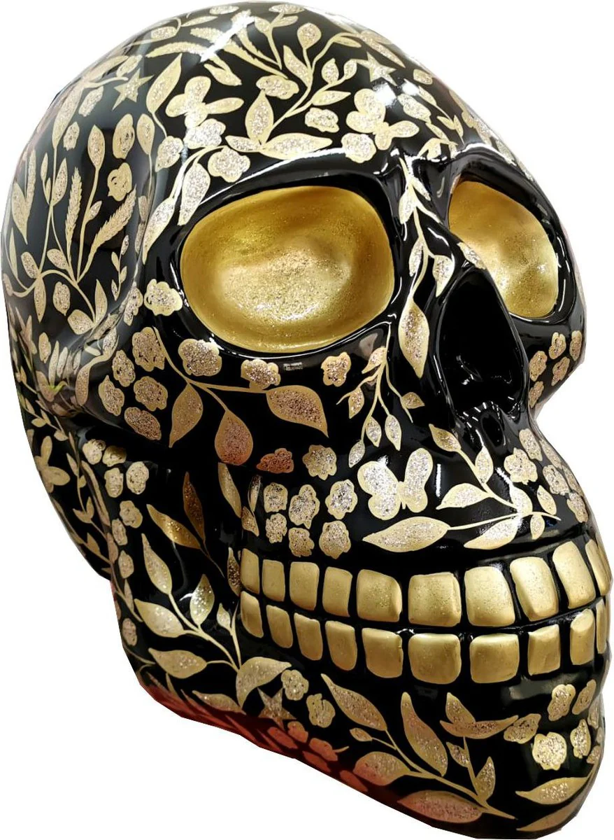Casa Padrino figura decorativa de diseño calavera con óptica purpurina negro / oro 44 x 58 x A. 66 cm - Escultura decorativa resistente a la intemperie - Escultura Decorativa de Diseño