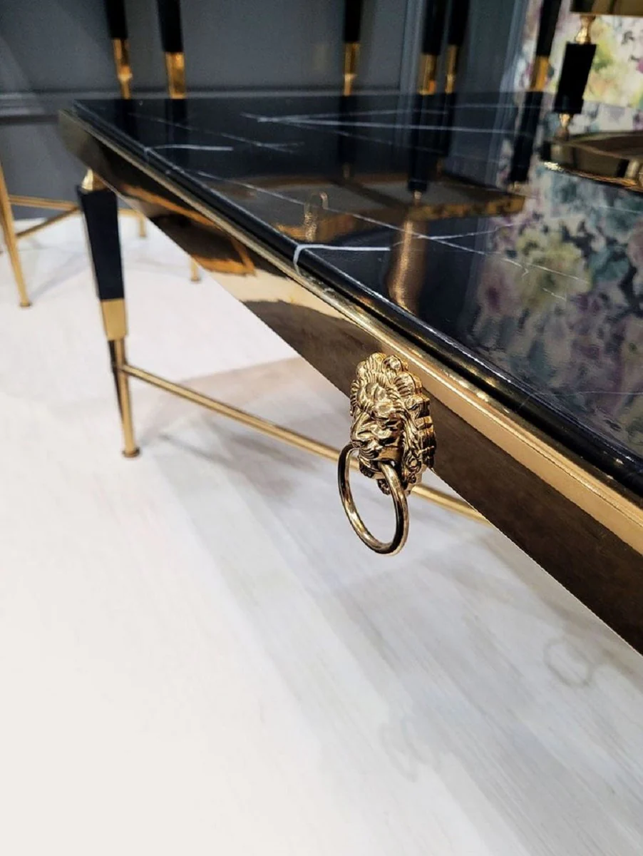 Casa Padrino mesa de centro de lujo negro / oro 130 x 70 x A. 45 cm - Mesa de sal¨®n con tablero de m¨¢rmol artificial - Muebles de sal¨®n de lujo - Muebles de hotel - Interior de lujo