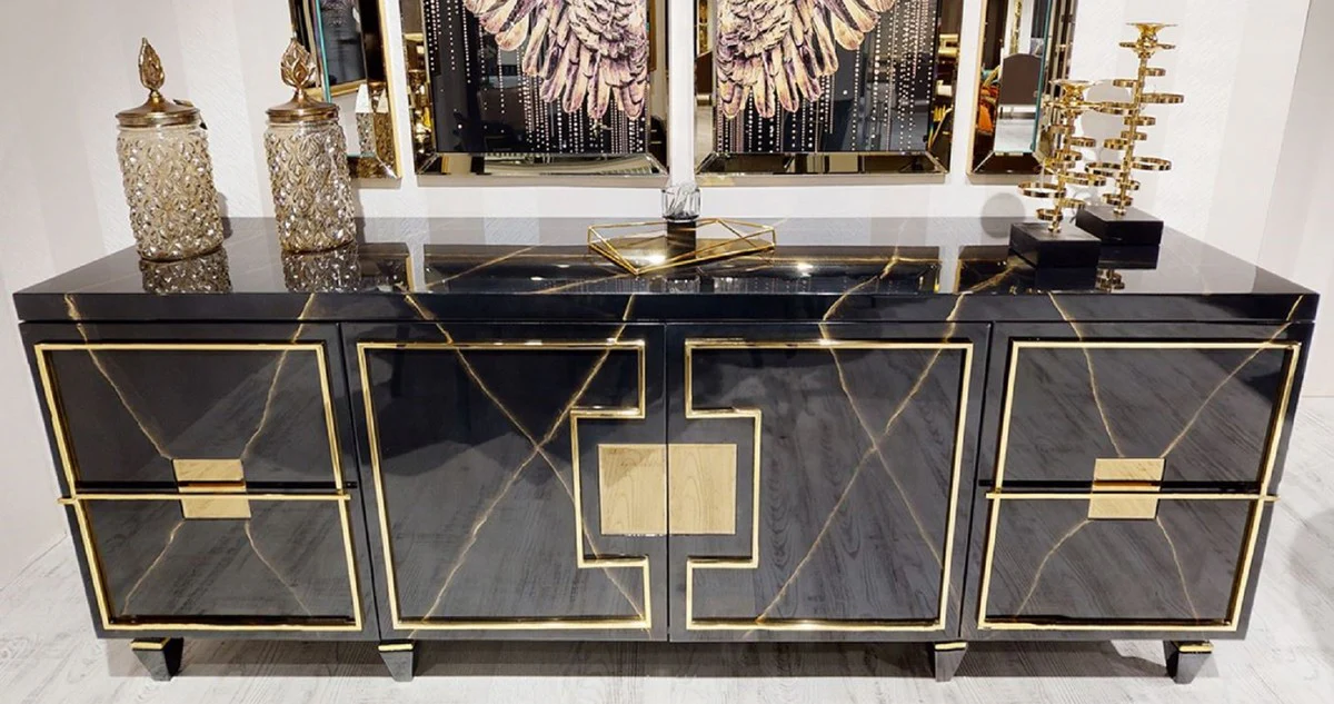 Casa Padrino aparador Art Deco de lujo negro / oro - Armario noble de madera maciza con 4 puertas - Muebles para Sal¨®n y Hotel Art Deco de Lujo