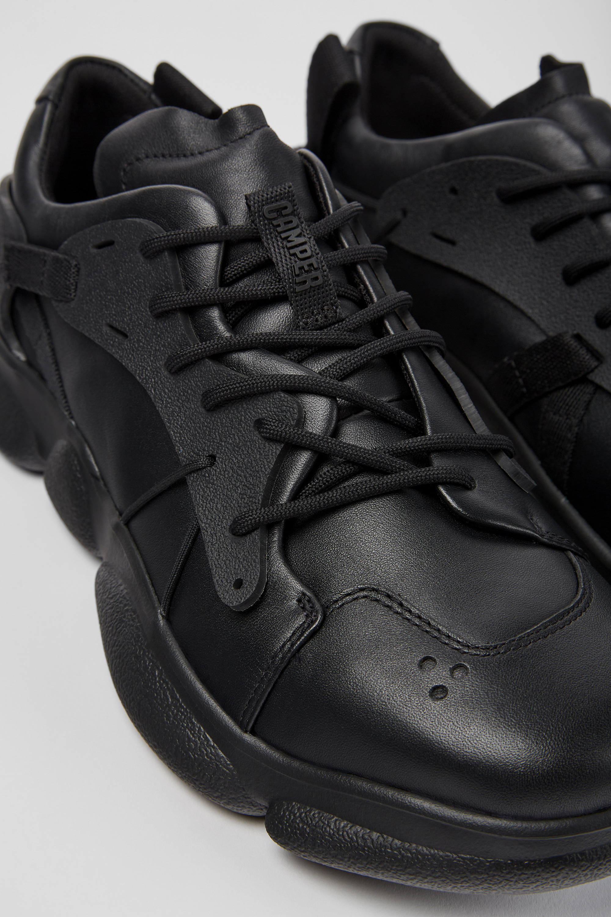 Karst - Black leather and textile sneakers for men