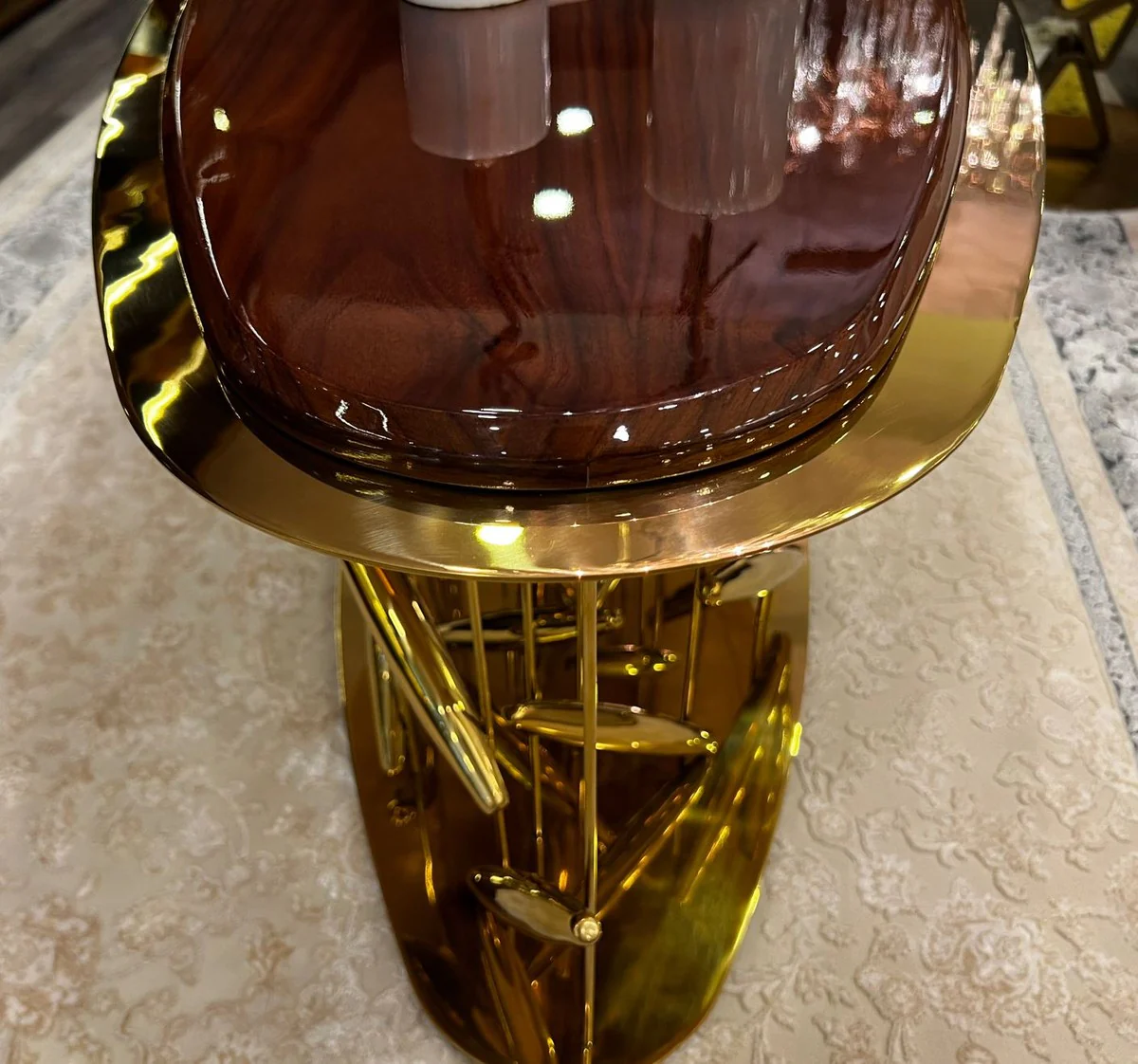 Casa Padrino mesa de centro de lujo marr¨®n / oro 120 x 51 x A. 47 cm - Mesa de sal¨®n ovalada de acero inoxidable con tablero de madera maciza - Muebles de sal¨®n - Muebles de lujo