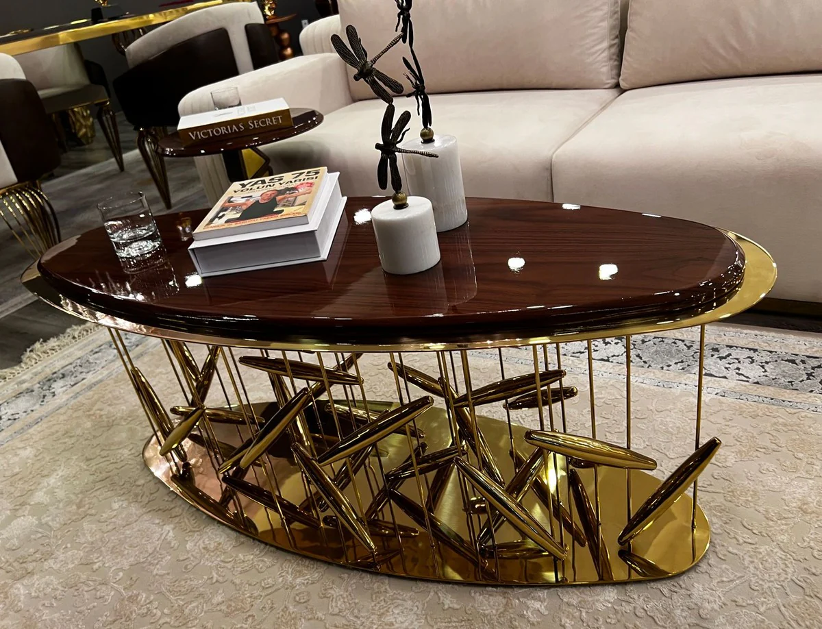 Casa Padrino mesa de centro de lujo marr¨®n / oro 120 x 51 x A. 47 cm - Mesa de sal¨®n ovalada de acero inoxidable con tablero de madera maciza - Muebles de sal¨®n - Muebles de lujo