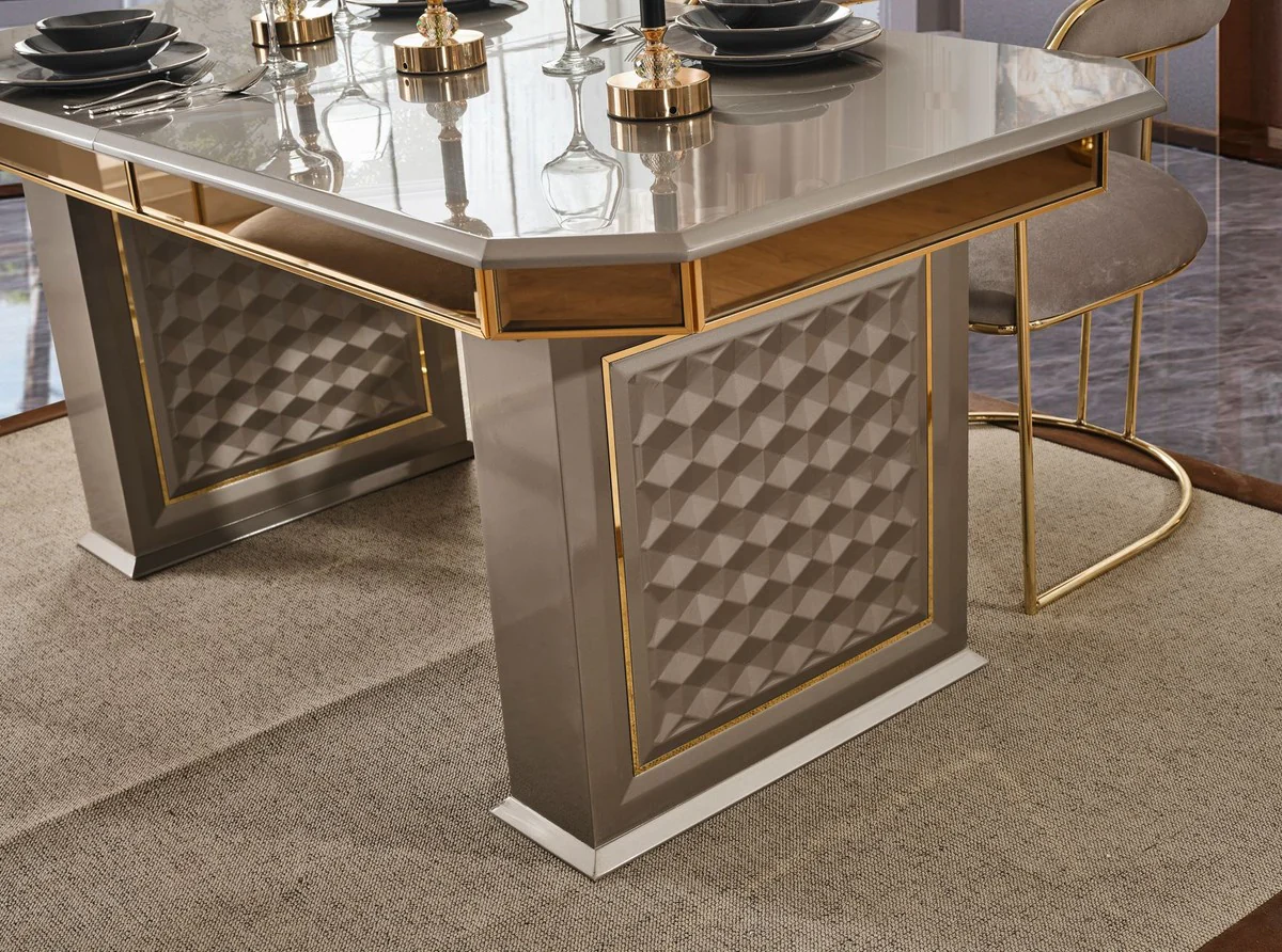 Casa Padrino conjunto de comedor Art Deco de lujo gris / oro - 1 Mesa de Comedor Extensible y 6 Sillas de Comedor con Reposabrazos - Muebles de comedor - Muebles Art Deco - Muebles de lujo